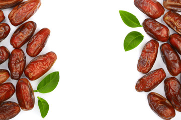 Obraz premium dry dates with green leaves isolated on white background with copy space for your text. Top view. Flat lay pattern