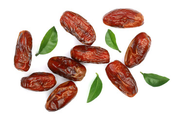dry dates with green leaves isolated on white background. Top view. Flat lay pattern