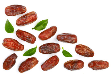 dry dates with green leaves isolated on white background with copy space for your text. Top view. Flat lay pattern
