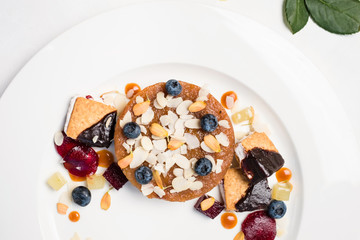 dessert pastries and confectionery assortment on white background. delicious restaurant food. overeating problems.