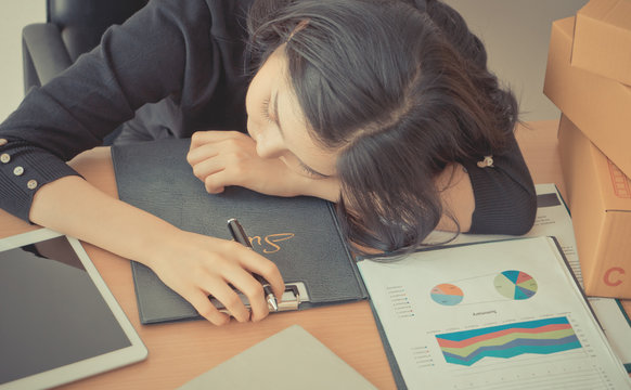 Office Woman Sleeping Over Her Work On Office Desk