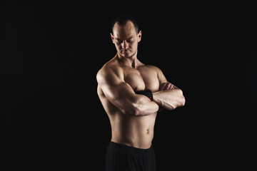 Fototapeta premium Strong athletic man showes naked muscular body