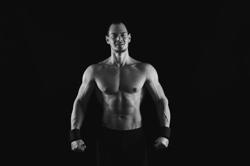 Naklejka premium Strong athletic man showes naked muscular body