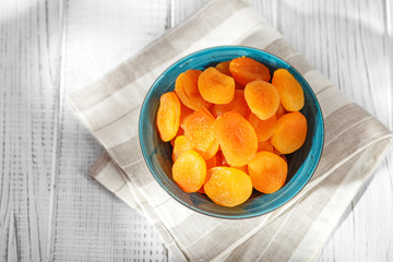 Useful delicious dried apricots in a plate. Copy Space. The concept is healthy food, diet, vegetarianism.