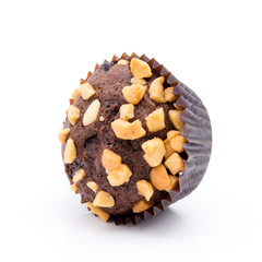 One chocolate muffins with nuts crumbs isolated on white background