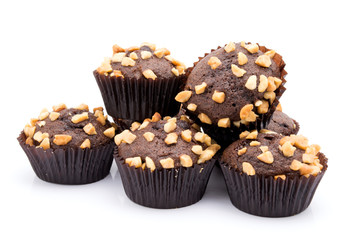 Group of chocolate muffins with nuts crumbs isolated on white background