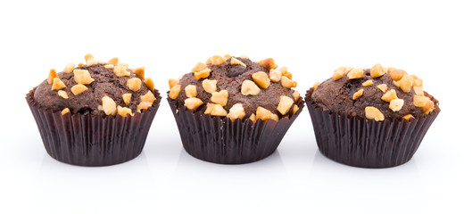 Group of chocolate muffins with nuts crumbs isolated on white background