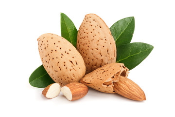 Group of almond nuts with leaves isolated on white background