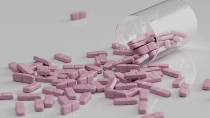 Rosa Tabletten liegen verteilt auf einem Tisch