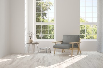 Fototapeta premium Idea of white room with armchair and summer landscape in window. Scandinavian interior design. 3D illustration