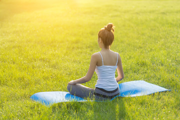 Woman yoga in the park