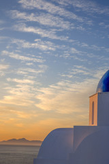 Fototapeta na wymiar Santorini sunrise at a church near Pori Oia on the Greek Island of Santorini Greece