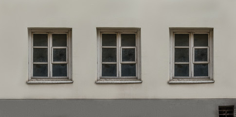 Old European classic building three windows facade