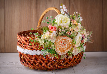 Fototapeta na wymiar Decorative basket decorated with flowers
