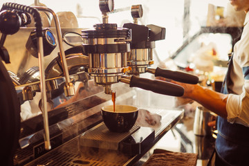 barista make coffee latte art with coffee espresso machine in coffee shop cafe in vintage color tone - 189983503