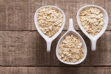 oatmeal straws in bowl on wood