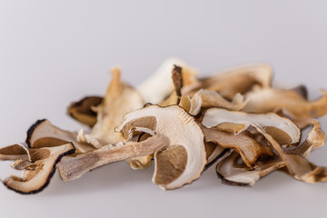dried porcini mushrooms Dried porcini mushrooms on a white background. Food background. Rustic style.