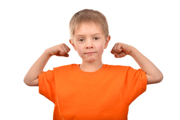 Emotional portrait of a teenager. A boy in an orange t-shirt. Beautiful and happy child isolated on a white background.