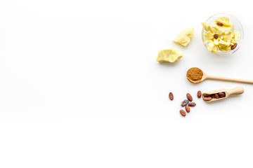 Cocoa butter for skin care. White background top view copy space
