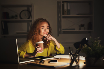 Woman dreaming at home during working