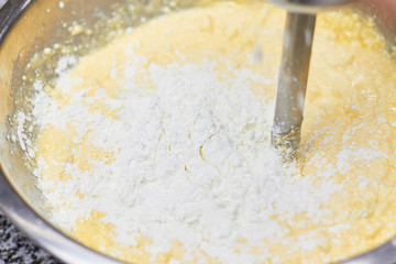 Mixed yellow dough with white dough. Added white raw dough close up.