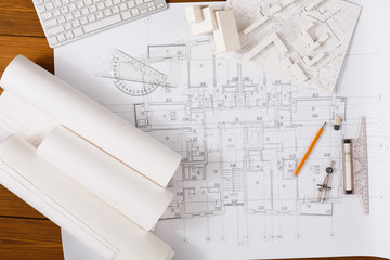 Architectural project, engineering tools on table.