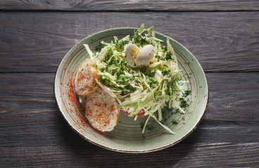 Salad with fresh cabbage, quail eggs and toasts