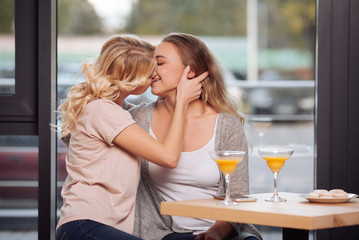 Nice happy women kissing