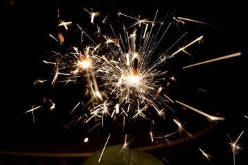 Fototapeta premium sparkler in a dark room