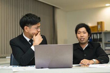 Fototapeta na wymiar Two asian businessmen discuss about business of company,Two people are talking about work stress and more serious.