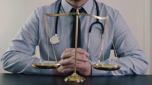Medical law and justice. Health care balance.Lawyer or Doctor present his confidence in slow motion