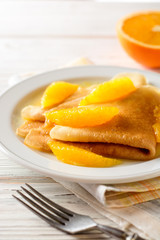Crepe suzette, traditional french dessert with thin pancakes and orange sauce.
