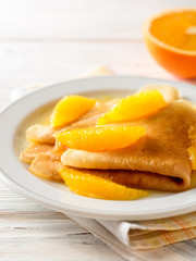 Crepe suzette, traditional french dessert with thin pancakes and orange sauce.