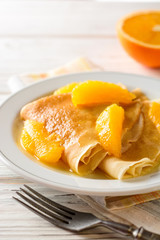 Crepe suzette, traditional french dessert with thin pancakes and orange sauce.