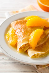 Crepe suzette, traditional french dessert with thin pancakes and orange sauce.