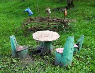Table and chairs made of stumps and natural material