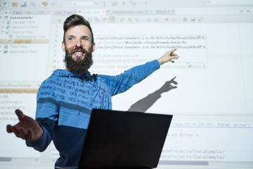 programmer courses at education center. Man teacher gesticulates while lecturing on information and...