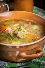 Pea soup with vegetables and bacon.