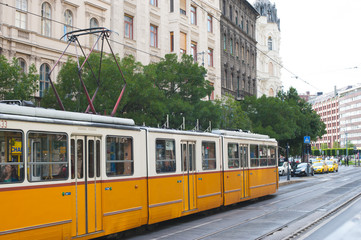 Fototapeta na wymiar Tram riding in the street, European city