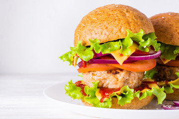 Ready-to-eat cheeseburger on a plate