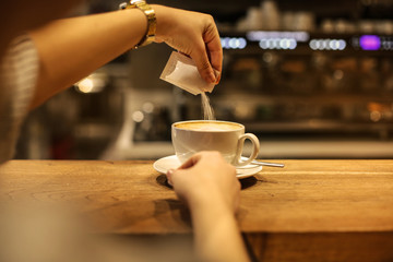 Fototapeta na wymiar Drinking a delicious cappuccino