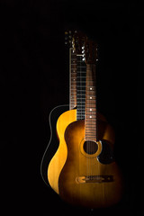 Fototapeta na wymiar Three acoustic guitars on black background