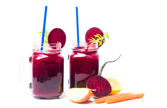 Healthy beet smoothie in a jar isolated