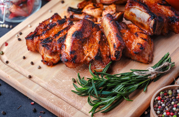 Grilled meat and vegetables on rustic wooden table