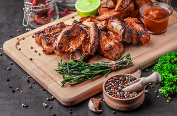 Grilled meat and vegetables on rustic wooden table