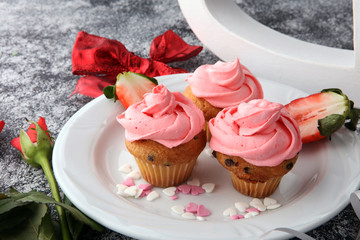 Delicious cupcake for Valentine Day. cake for Valentines day with chocolate and strawberries. Traditional homemade with red roses