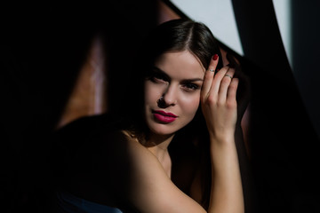 Fototapeta premium Sexy young woman posing in a natural lighting