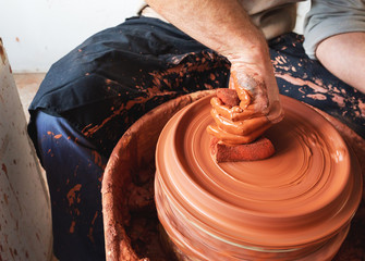 Pottery artist crafting a ceramic vase