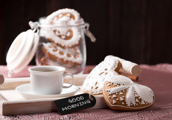 beautiful decorated cookies with a cup of coffee