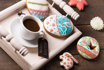   Beautiful glazed Easter cookies on wooden table